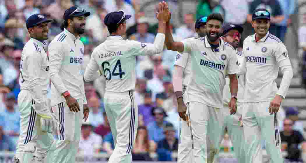 India's Mohammed Siraj with teammates celebrates after taking the wicket of England's Jacob Bethell.