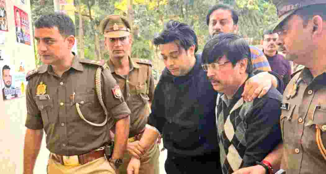 Shivam Mishra being escorted to a police station in Kanpur. Shivam Mishra being escorted to a police station in Kanpur.