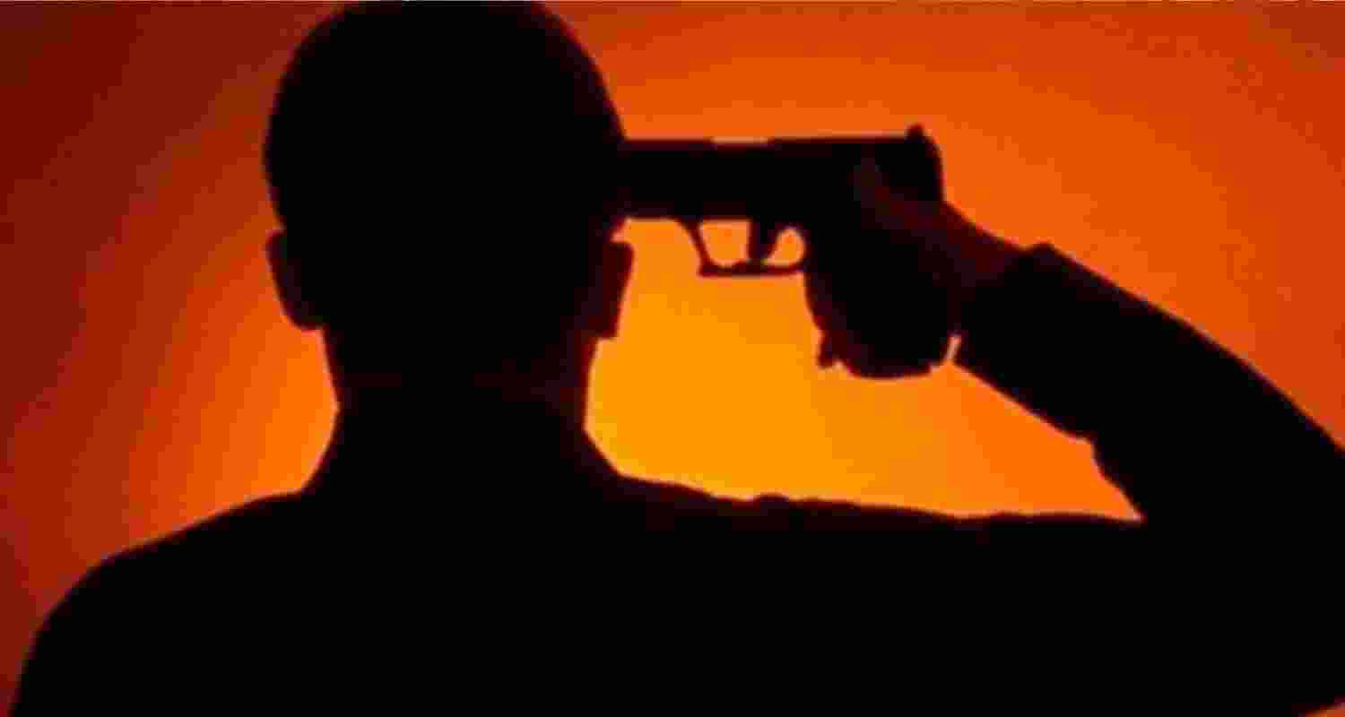 Image of a man shooting himself. 