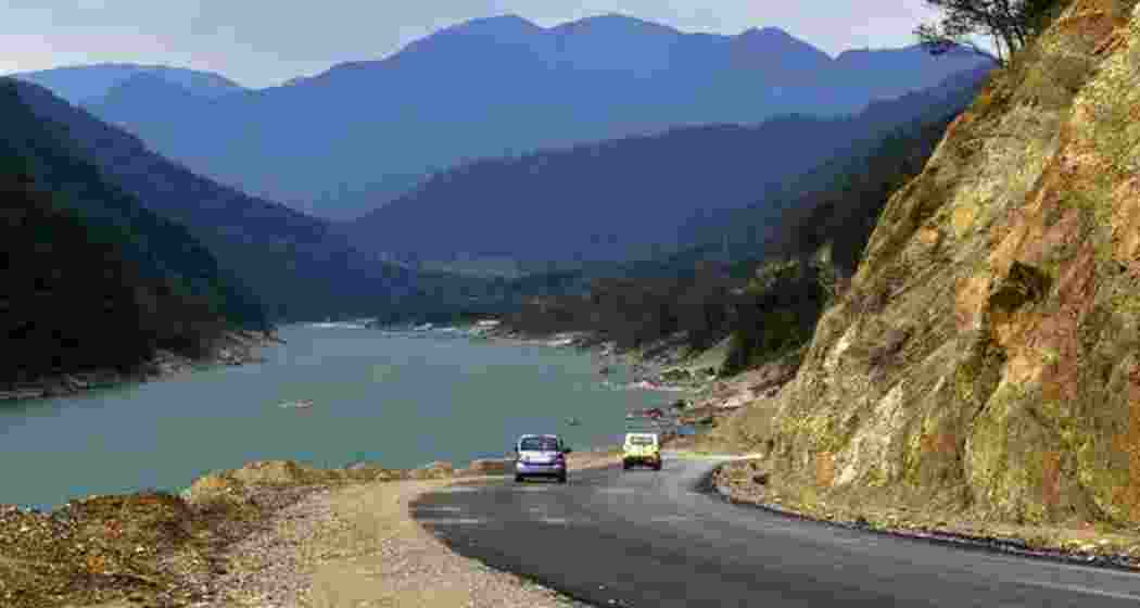 A scenic road runs alongside the Siang River in Pasighat, East Siang district, Arunachal Pradesh, reflecting the region's natural beauty and its significance in upcoming hydropower initiatives.