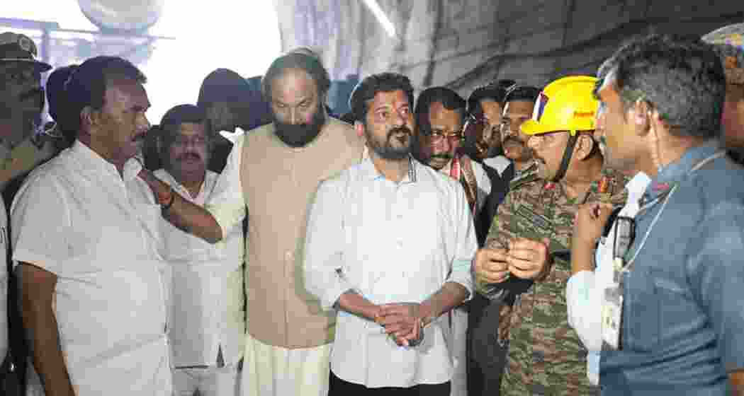 Telangana Chief Minister Revanth Reddy inspects the SLBC tunnel collapse site in Nagarkurnool on Sunday, reviewing ongoing rescue efforts to locate the eight trapped workers. Officials brief him on the challenges faced.