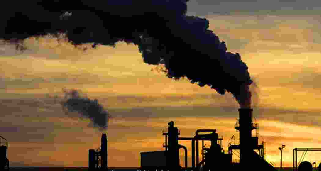 Smoke billows from a crude oil facility. 