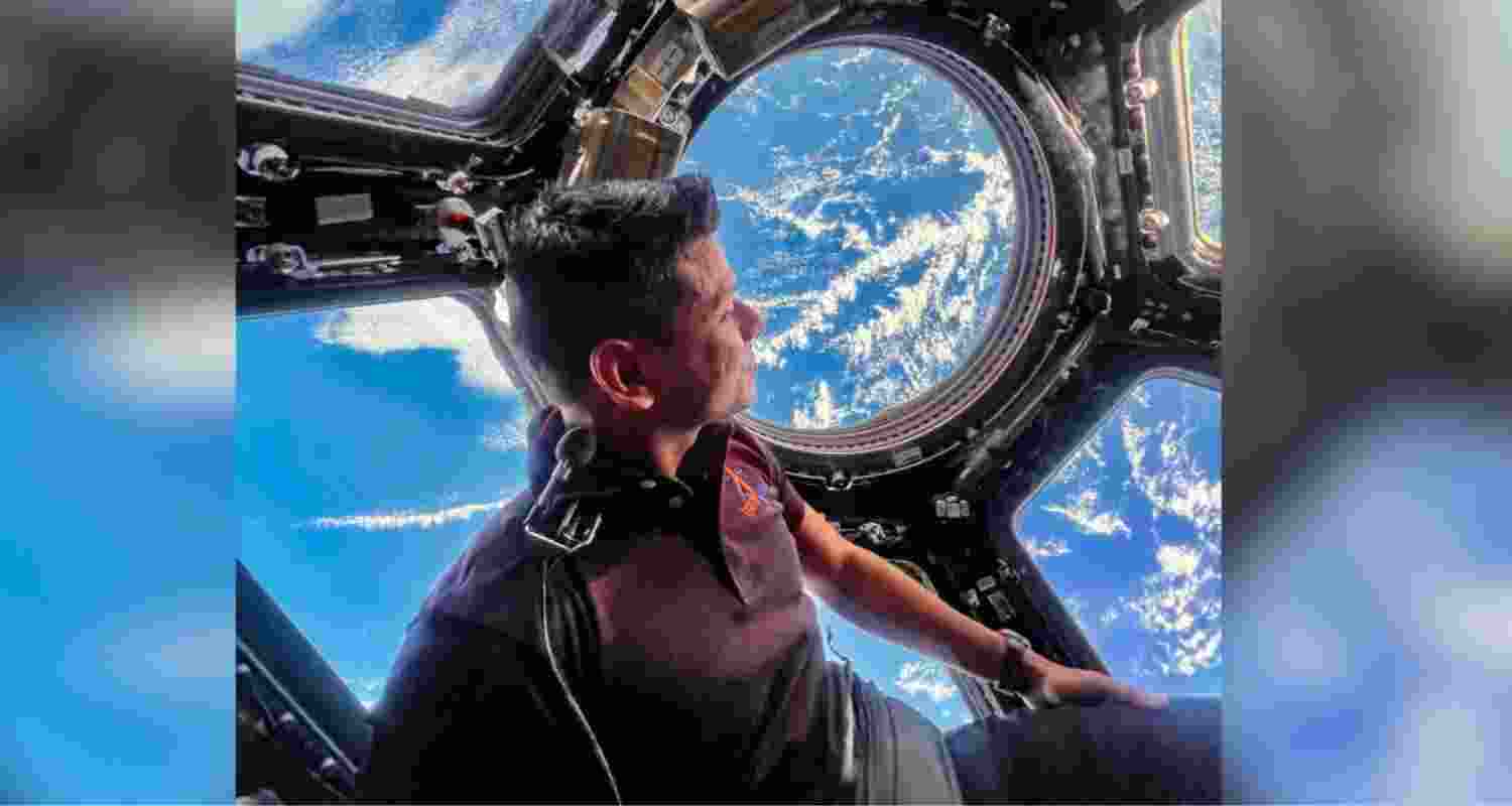 Shubhanshu Shukla looks down towards Earth from the iconic cupola of ISS.