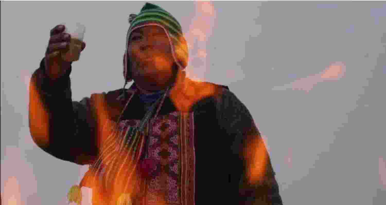 Spiritual leader Eusebio Huanca burns offerings observing the month of Pachamama, on La Cumbre, Bolivia, on August 1, 2025.