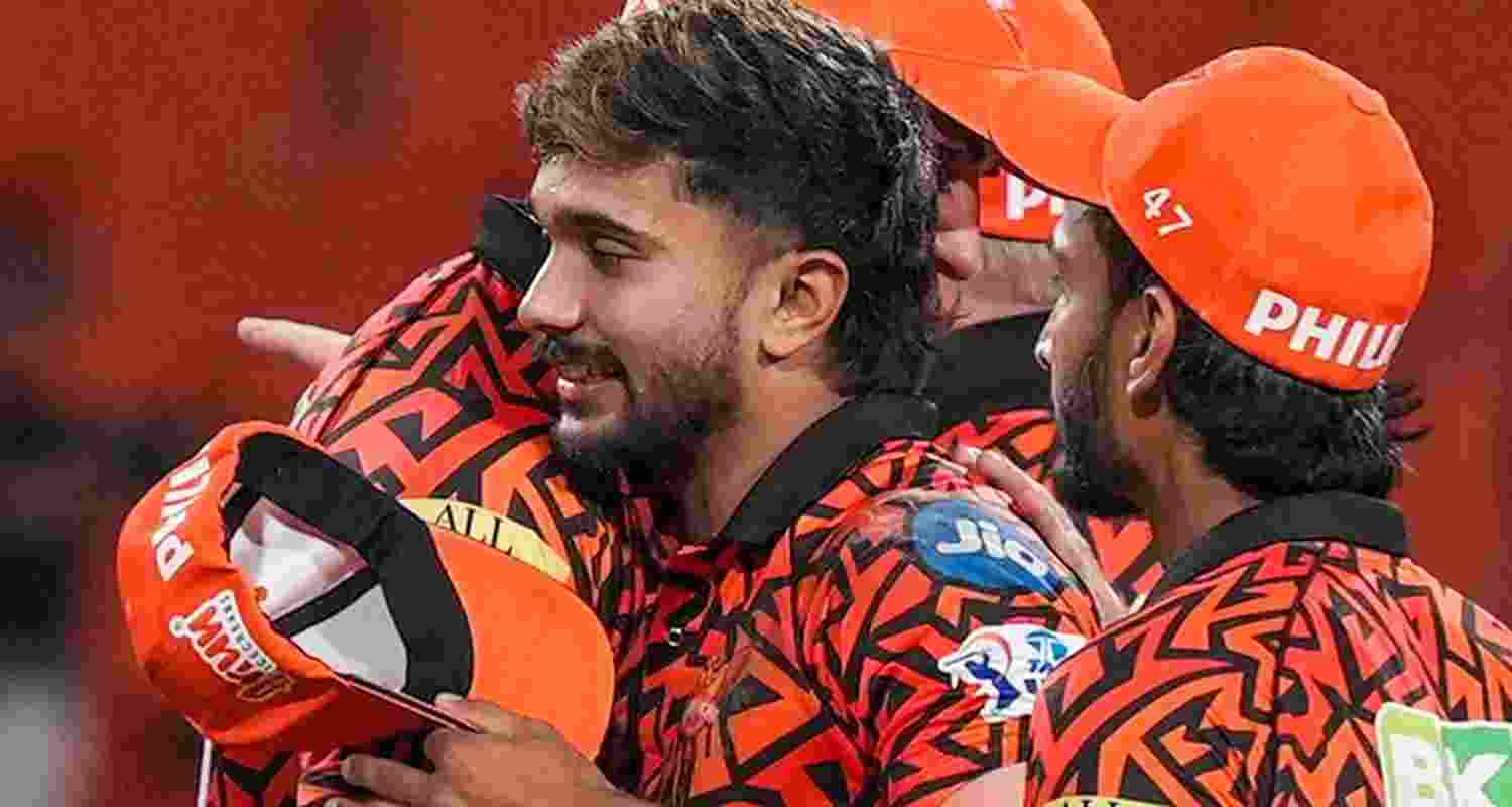 Sunrisers Hyderabad's Nitish Kumar Reddy with captain Pat Cummins. 