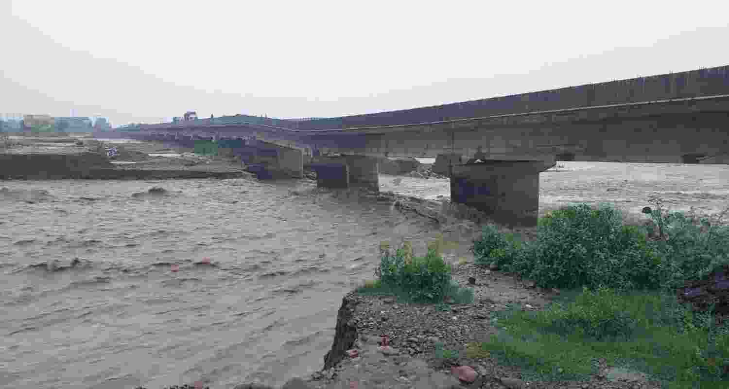 Jammu-Pathankot National Highway has been rendered impassable as a bridge on the Tarnah Nallah has suffered damage due to heavy rains. The traffic is presently being diverted through the border road.