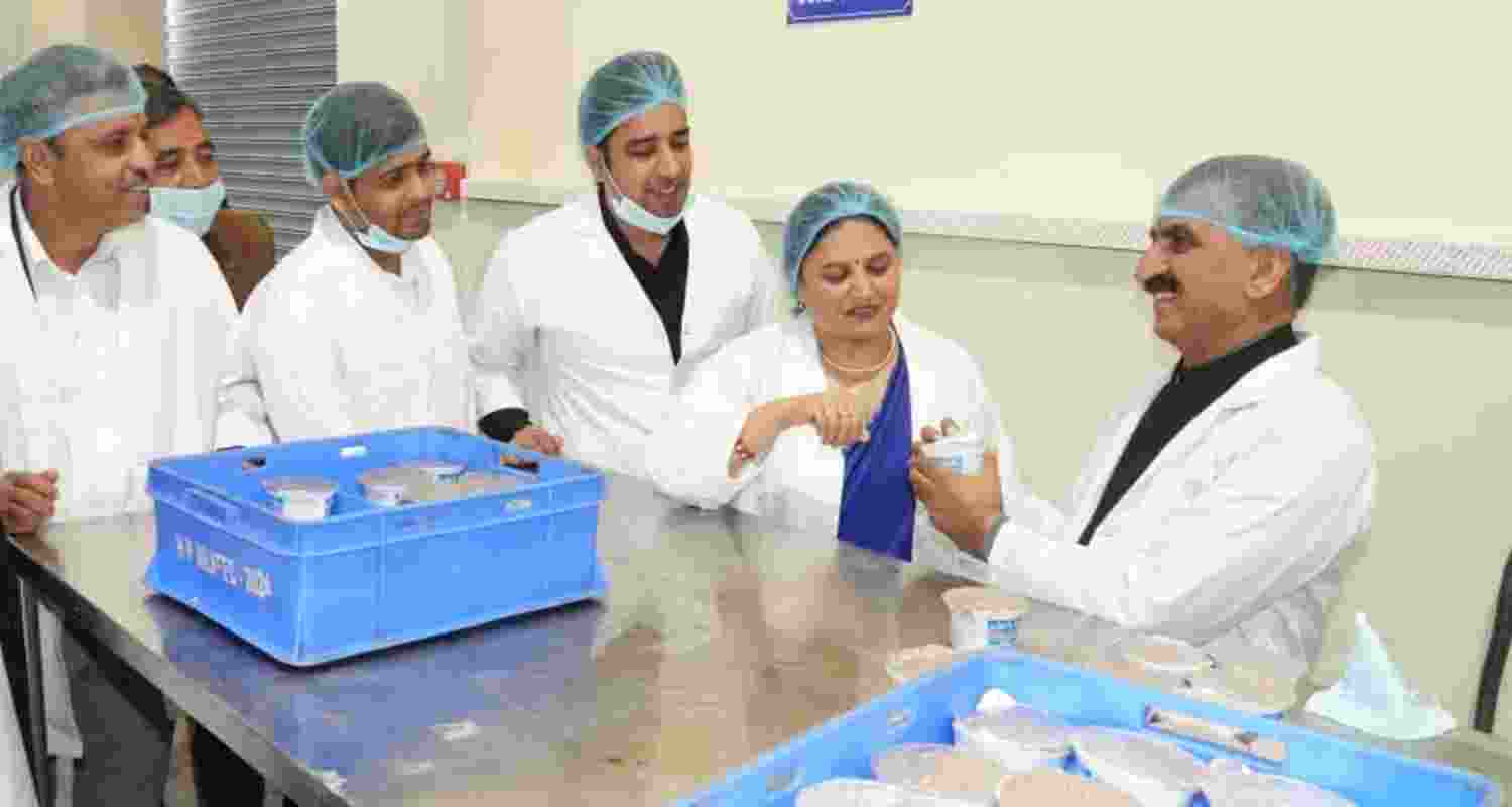 Himachal CM Sukhu inspecting the curd section at the milk processing facility.