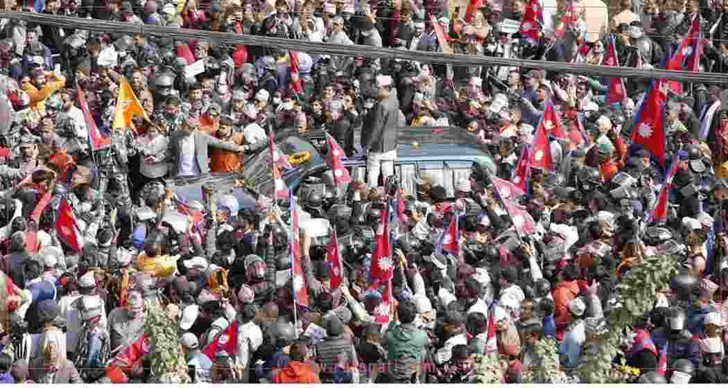  Nepal's former monarch Gyanendra Shah swarmed by supporters after his arrival at the Kathmandu airport.
