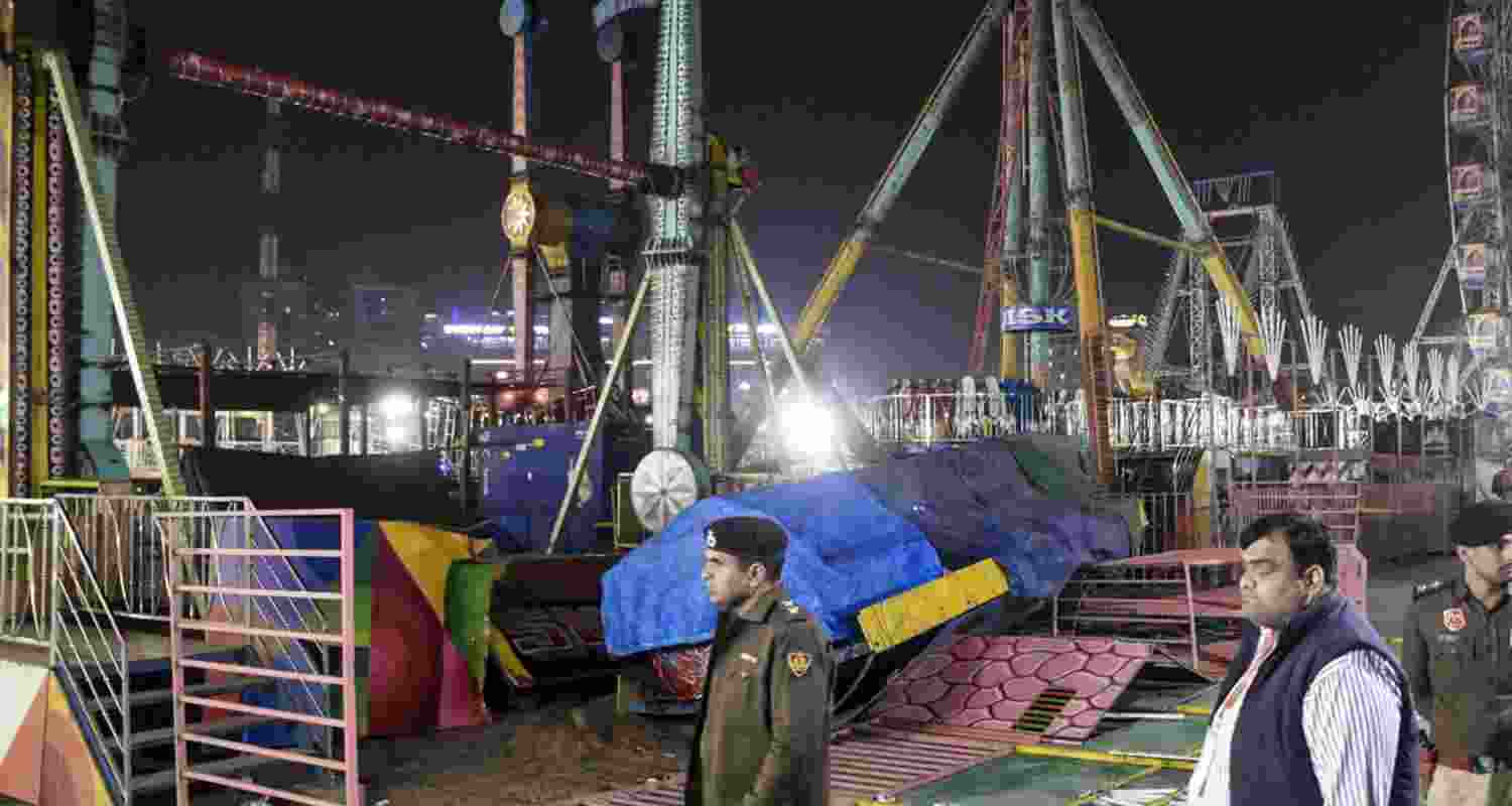 Police personnel at the spot after a swing fell down at Surajkund fair, in Faridabad, Saturday, Feb. 7, 2026. A police officer was killed and 13 other suffered injuries. 