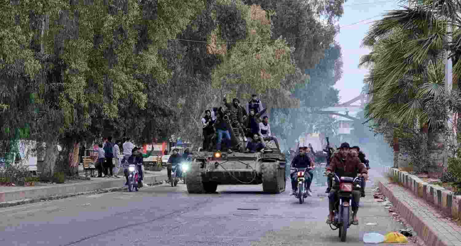 Syrian rebels, seen taking a captured tank in this image, have taken over the reins of the government in the conflict-torn nation after the ouster of Bashar-Al-Assad.