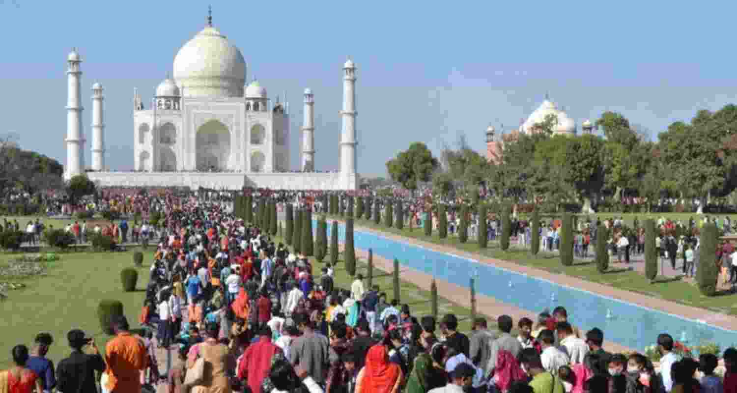 Tourists at the Taj Mahal in Agra, Uttar Pradesh - file image.