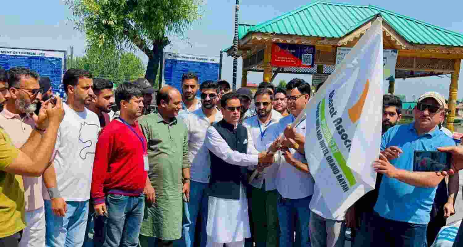 Tanvir Sadiq of Ruling JKNC flagging off the Road rally for tourism revival in Kashmir on Sunday.