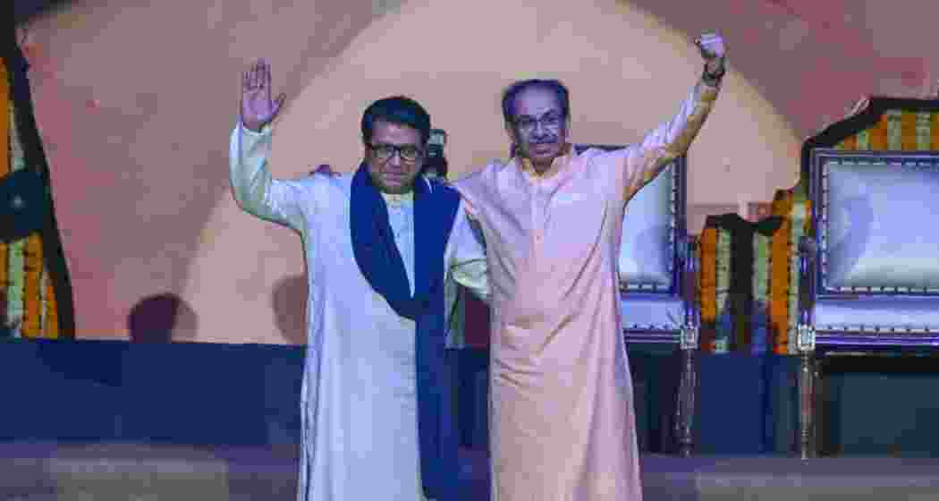 Uddhav and Raj Thackeray embrace on stage at Mumbai’s NSCI Dome on Saturday, vowing to stay united in the fight for Marathi pride and cultural identity ahead of civic elections.