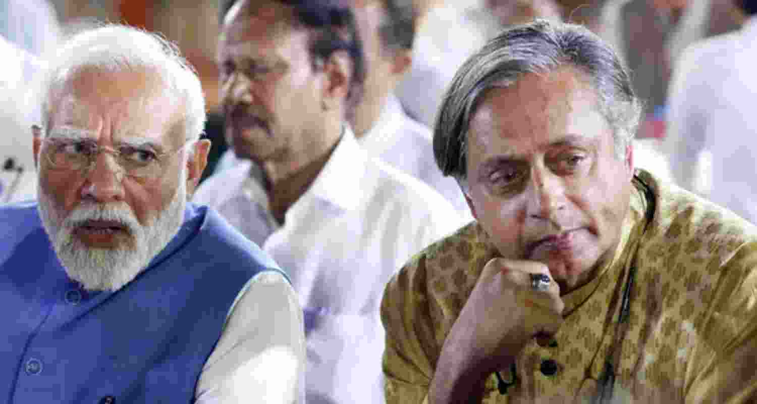 A file photo of Prime Minister Narendra Modi with Congress MP Shashi Tharoor in New Delhi.