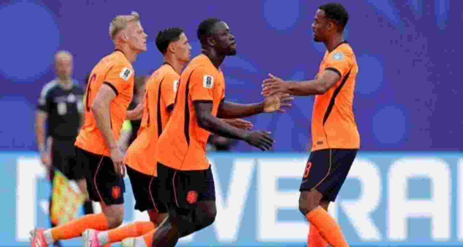 Netherlands advance to knockout stages with a win over Tunisia Netherlands advance to knockout stages with a win over Tunisia