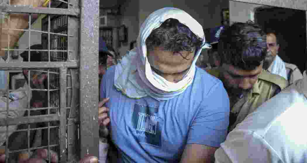 Samarth Singh, husband of model-turned-actor Twisha Sharma and an accused in her death allegedly due to dowry harassment, being taken into police custody after his appearance in a court, in Bhopal, on Saturday. A court in Bhopal on Saturday remanded Singh to a seven-day police custody. (PTI Photo)