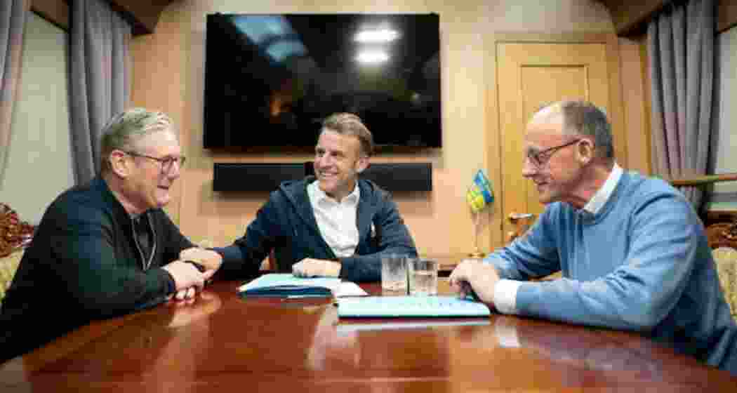UK Prime Minister Keir Starmer meets with France's President Emmanuel Macron and Germany's Chancellor Friedrich Merz on board a train to the Ukrainian capital Kyiv where all three held meetings with Ukrainian President Volodymyr Zelensky, May 9, 2025.
