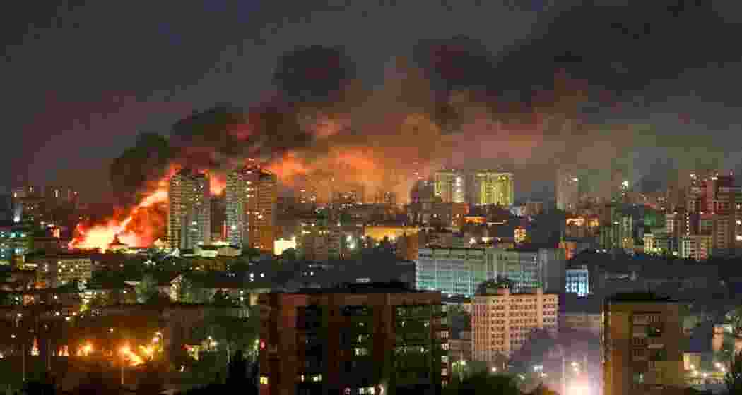 Smoke rises above Kyiv following Russia’s retaliatory drone and missile assault on Friday. The barrage caused multiple fatalities, infrastructure damage, and sparked fires in residential and industrial areas across the capital.