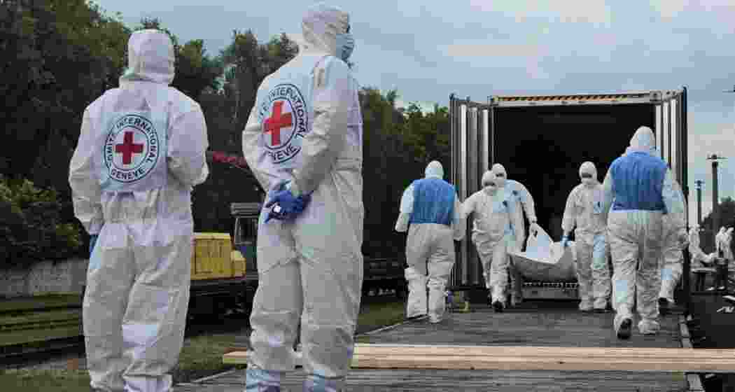 Russian officials oversee the transfer of bodies across the frontline under a prisoner exchange deal with Ukraine, as part of a humanitarian arrangement agreed during talks in Istanbul earlier this month.