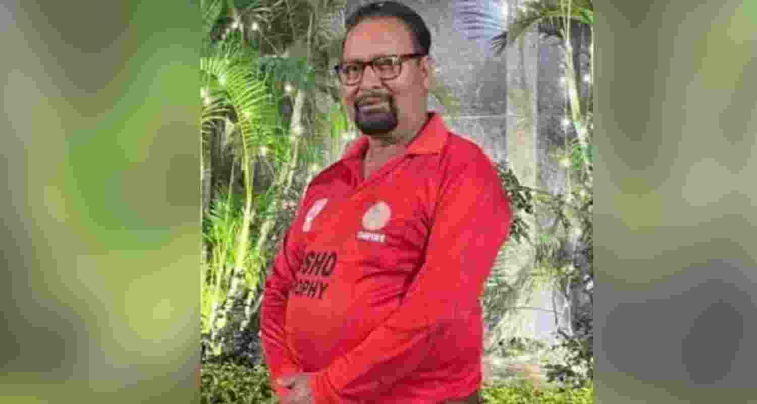 Deceased umpire, identified as Manik Gupta. 