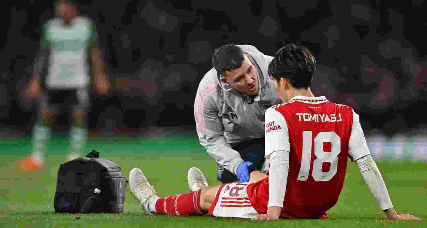 Arsenal defender Takehiro Tomiyasu sidelined after knee surgery.