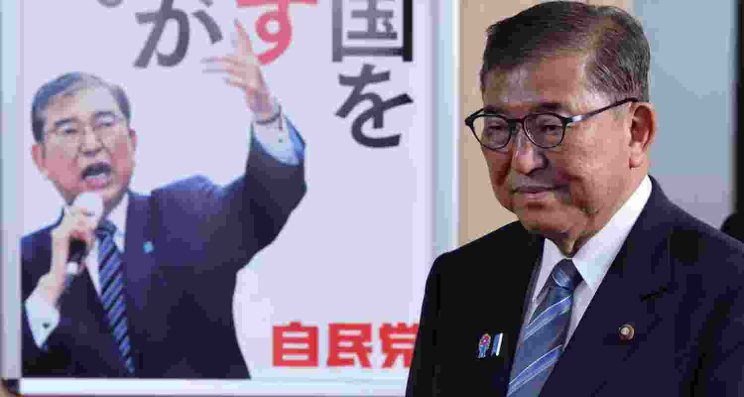 PM Ishiba rejects claim he will resign next month.