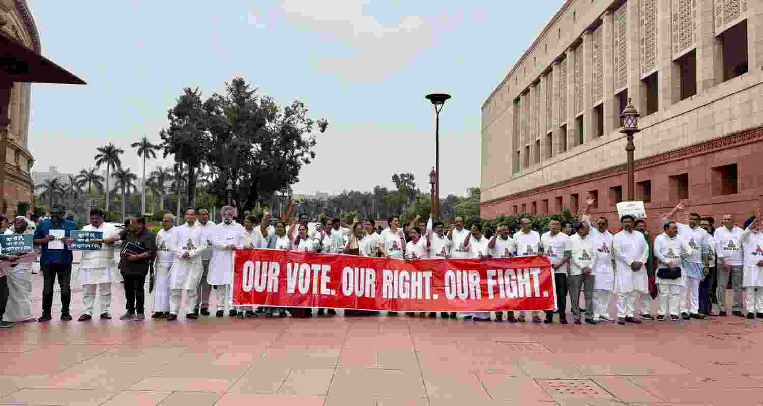 Opposition MPs wear '124 Not Out' T-shirts in Parliament stir.