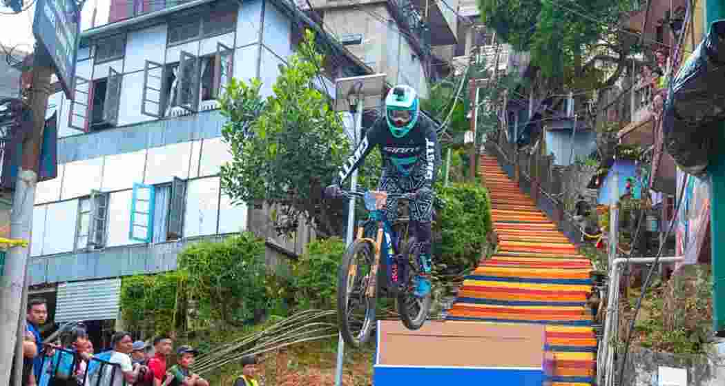 A biker races down Aizawl's steep alleys during the first Red Bull Tlang Ruam, Asia’s only urban downhill event. The city readies for a grander second edition.
