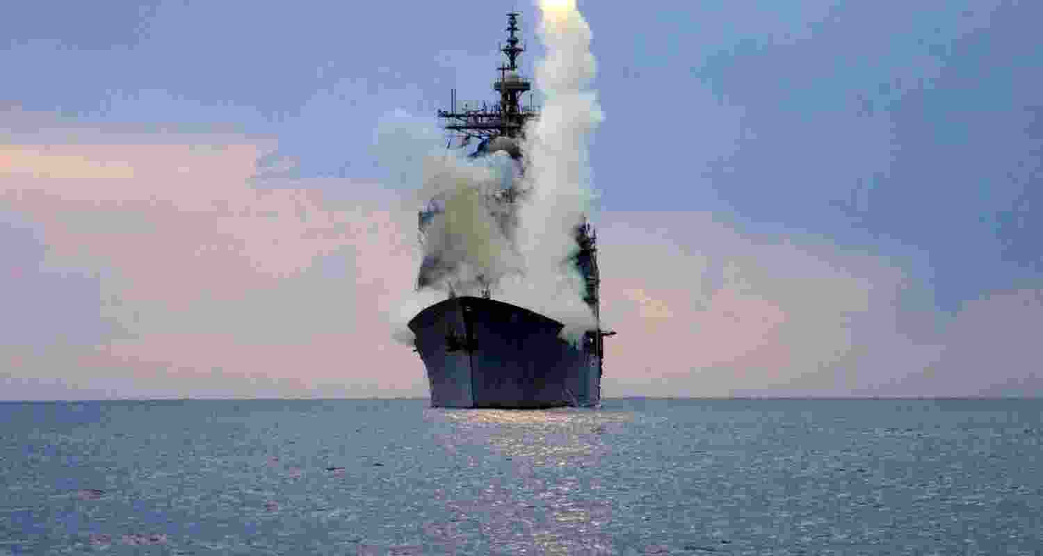 A Tomahawk Land Attack Missile (TLAM) is launched from the guided missile cruiser USS Cape St. George, arch.