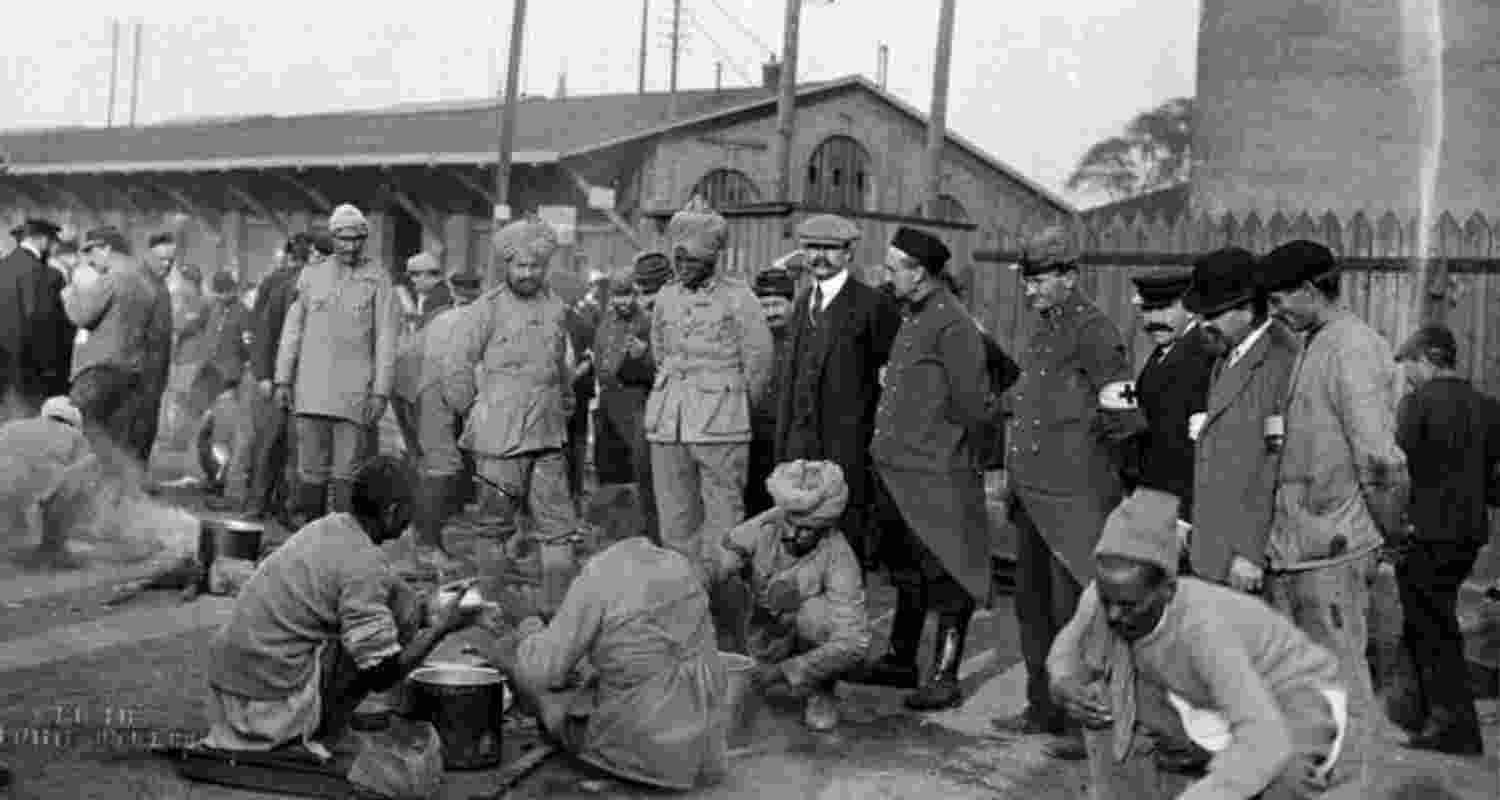 Indian soldiers under supervision of their bosses. Image from KJS Chatrath’s book 'Respectful Salutes to the Non-Combatant Indians who died in France During WWI'.