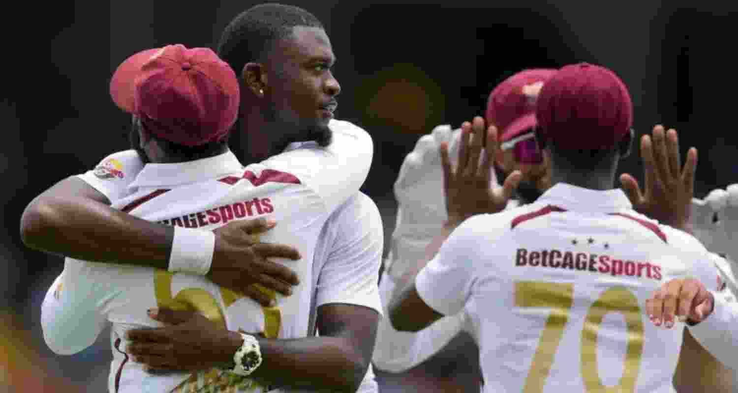 Jayden Seales of West Indies celebrates with teammates after dismissing Australia's Josh Inglis on the opening day of the first Test match at Kensington Oval in Bridgetown, Barbados.