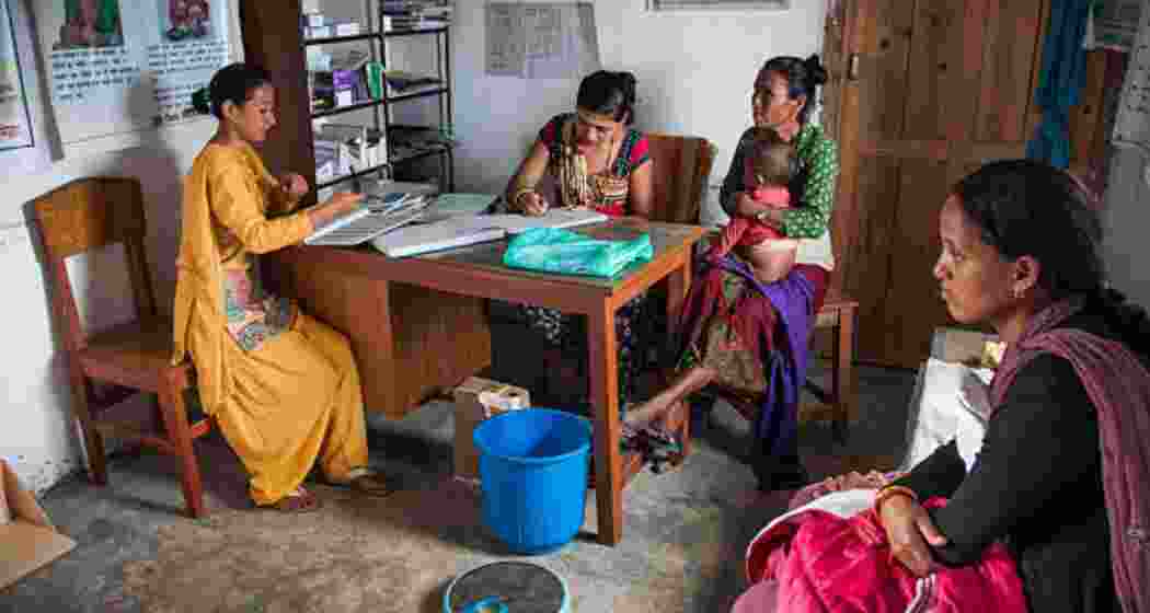A mother and her child at an ASHA centre during a routine health visit.