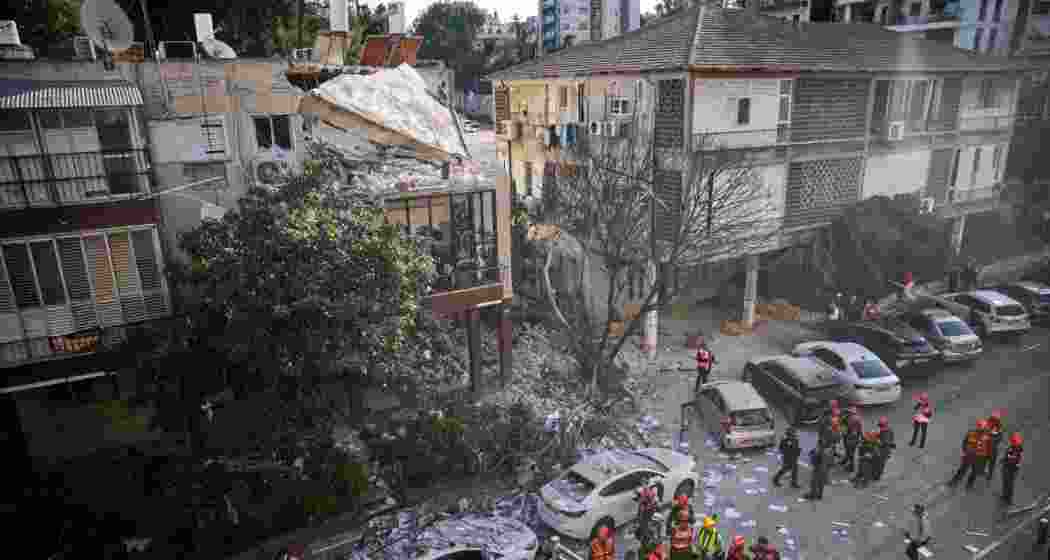 Officers from Israel's Home Front Command inspect a damaged apartment building after an Iranian missile strike in Ramat Gan, Israel, on Tuesday.