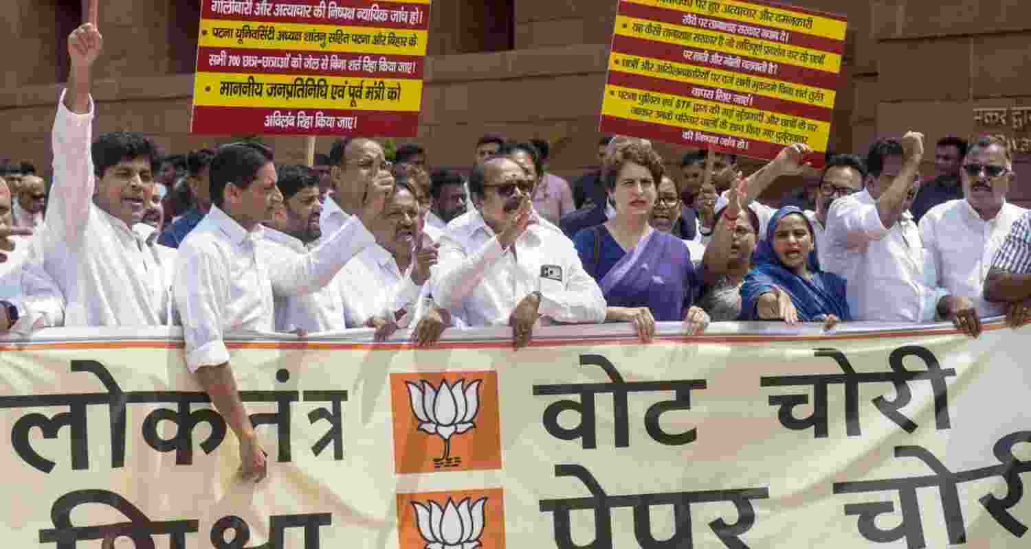 Congress MPs led by Priyanka Gandhi Vadra staging a protest in the Parliament House complex over the police action against students during the agitation over the NEET paper leak issue, on Monday. Congress MPs led by Priyanka Gandhi Vadra staging a protest in the Parliament House complex over the police action against students during the agitation over the NEET paper leak issue, on Monday.
