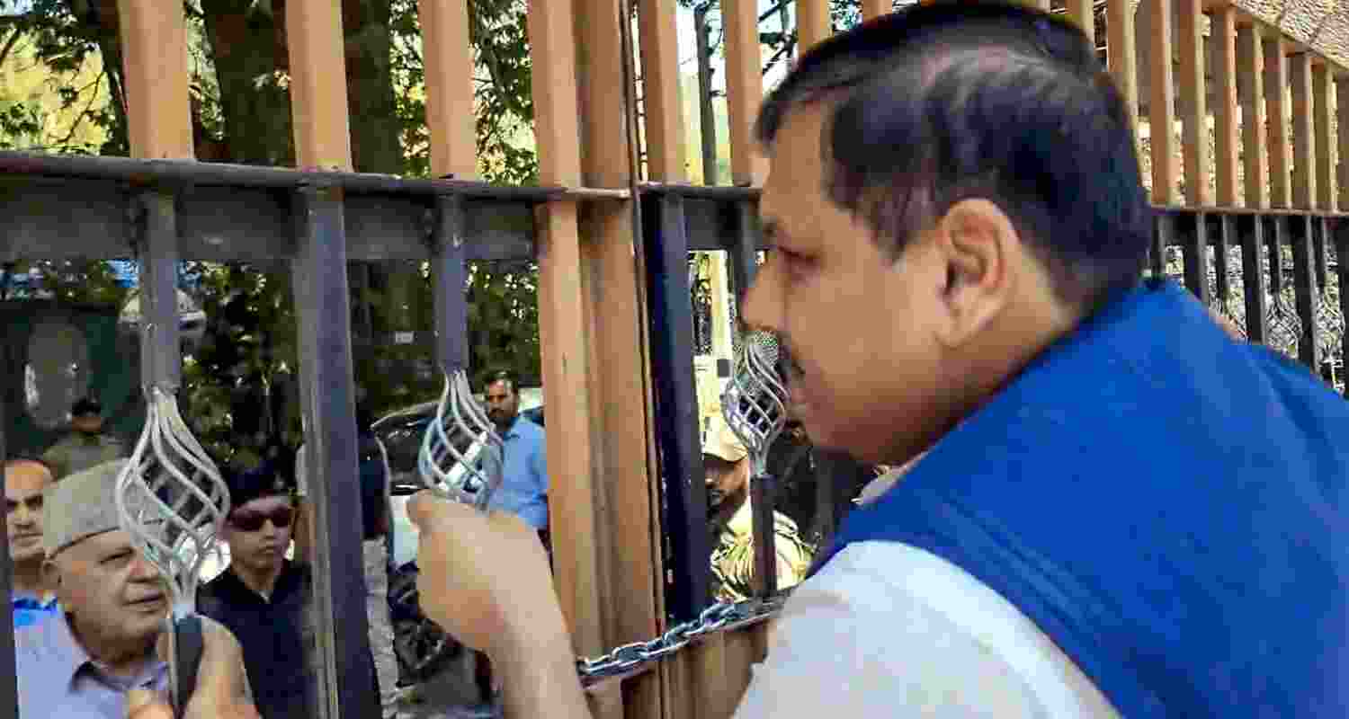AAP Rajya Sabha MP Sanjay Singh speaks with JKNC President Farooq Abdullah in Srinagar on Thursday. AAP Rajya Sabha MP Sanjay Singh speaks with JKNC President Farooq Abdullah in Srinagar on Thursday.