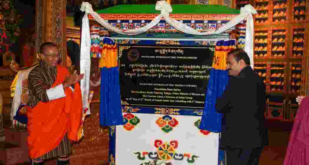 Adani with Bhutan Prime Minister Tshering Tobgay (L). Adani with Bhutan Prime Minister Tshering Tobgay (L).