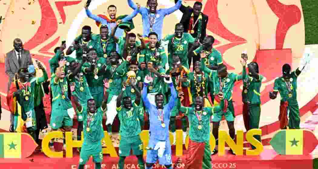 Senegal players celebrate with the trophy after winning the Africa Cup of Nations (CAN) final football match against Morocco at the Prince Moulay Abdellah Stadium in Rabat on Sunday. Senegal players celebrate with the trophy after winning the Africa Cup of Nations (CAN) final football match against Morocco at the Prince Moulay Abdellah Stadium in Rabat on Sunday.