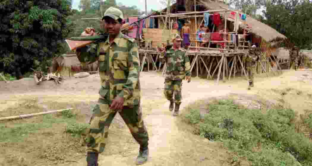 BSF men patrolling an unfenced stretch along India—Bangladesh border. BSF men patrolling an unfenced stretch along India—Bangladesh border.