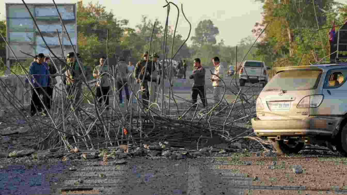 People look at a damaged bridge after Thailand carried out air strikes in an area between Cambodia's Oddar Meanchey and Siem Reap provinces. People look at a damaged bridge after Thailand carried out air strikes in an area between Cambodia's Oddar Meanchey and Siem Reap provinces.