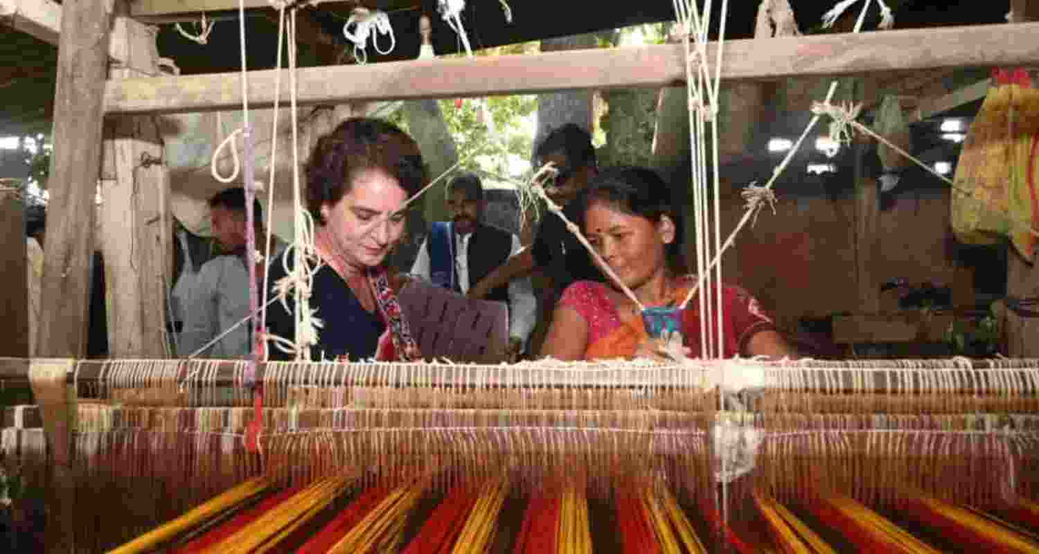 Congress General Secretary Priyanka Gandhi meets women weavers in Valmiki Nagar, Bihar, on Wednesday, and listens to their concerns. She promises support for the weaving community. Congress General Secretary Priyanka Gandhi meets women weavers in Valmiki Nagar, Bihar, on Wednesday, and listens to their concerns. She promises support for the weaving community.