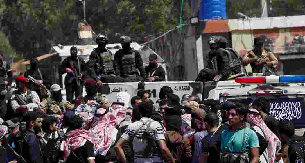 Security forces block Bedouin fighters, foreground from entering Sweida on Monday. Security forces block Bedouin fighters, foreground from entering Sweida on Monday.