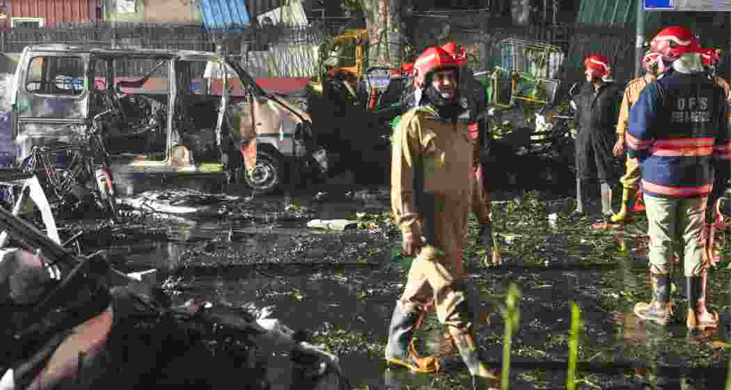 Firefighters at the spot after a blast occurred in a parked car near Red Fort, leaving multiple vehicles in flames, in New Delhi on Monday. Firefighters at the spot after a blast occurred in a parked car near Red Fort, leaving multiple vehicles in flames, in New Delhi on Monday.