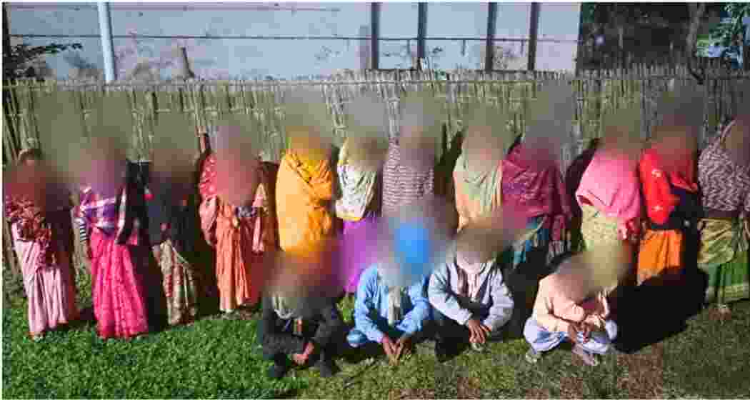 The 18 foreign nationals, apprehended for attempting illegal entry into India, pose for a photograph following their arrest. The 18 foreign nationals, apprehended for attempting illegal entry into India, pose for a photograph following their arrest.