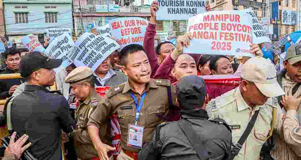 Protesters being confronted by security forces as they march towards the Sangai Festival venue in Imphal. Protesters being confronted by security forces as they march towards the Sangai Festival venue in Imphal.