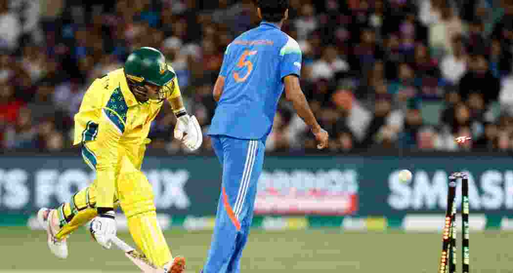 Australia's Alex Carey runs to make his ground as India's Washington Sundar watches during the one day international cricket match between Australia and India in Adelaide. Australia's Alex Carey runs to make his ground as India's Washington Sundar watches during the one day international cricket match between Australia and India in Adelaide.
