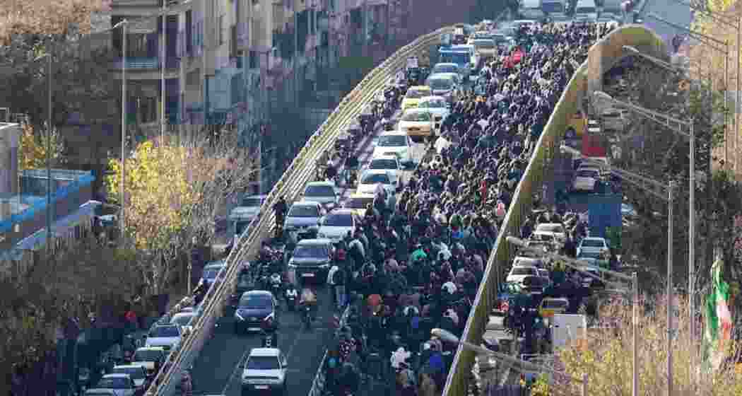 Demonstrators march through streets in Iran as protests over economic hardship spread nationwide, with at least 10 people reported dead. Demonstrators march through streets in Iran as protests over economic hardship spread nationwide, with at least 10 people reported dead.