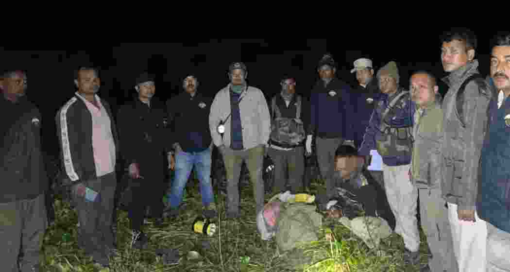 Assam Forest Department officials display seized tiger bones along with the accused poachers, following a raid near Kaziranga Tiger Reserve. Assam Forest Department officials display seized tiger bones along with the accused poachers, following a raid near Kaziranga Tiger Reserve.