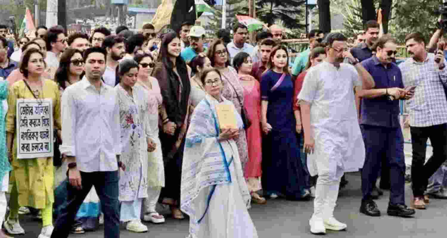 Chief Minister Mamata Banerjee, party national general secretary Abhishek Banerjee and Trinamool Congress leaders and supporters march to protest against SIR in West Bengal. Chief Minister Mamata Banerjee, party national general secretary Abhishek Banerjee and Trinamool Congress leaders and supporters march to protest against SIR in West Bengal.