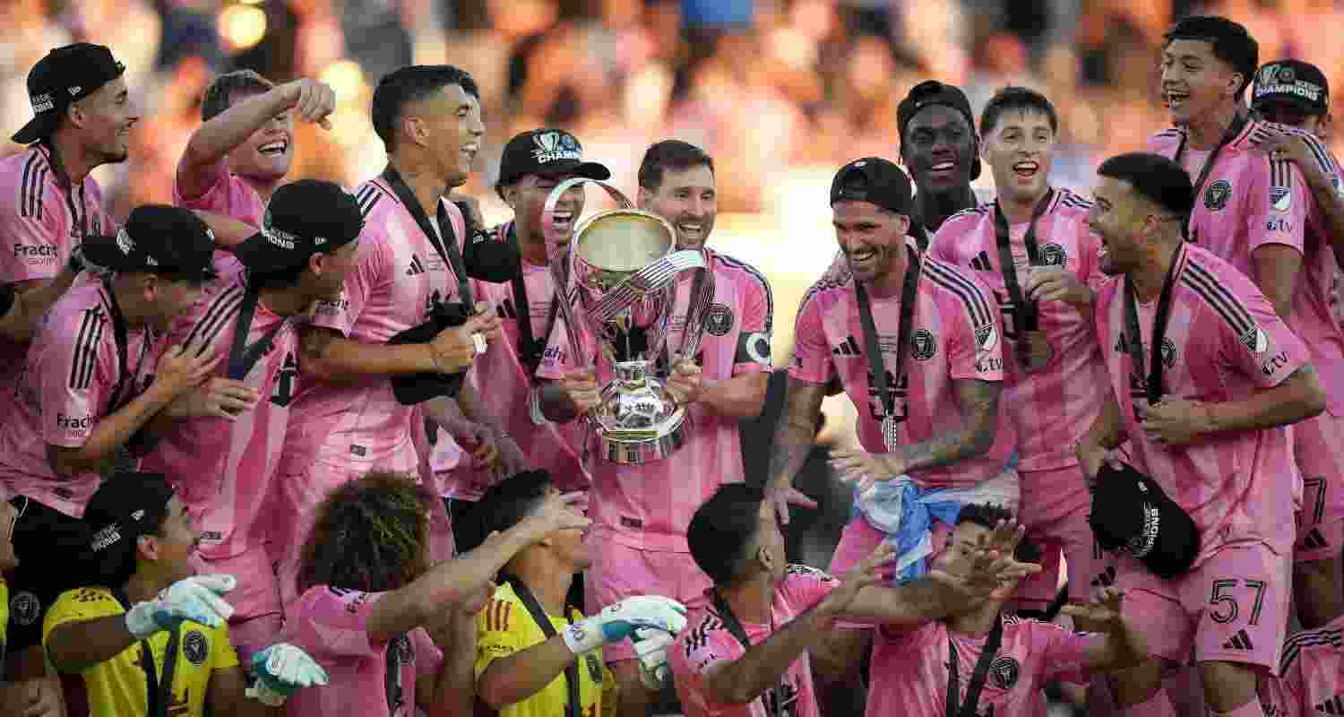 Lionel Messi celebrates lifting the MLS Cup with his teammates. Lionel Messi celebrates lifting the MLS Cup with his teammates.