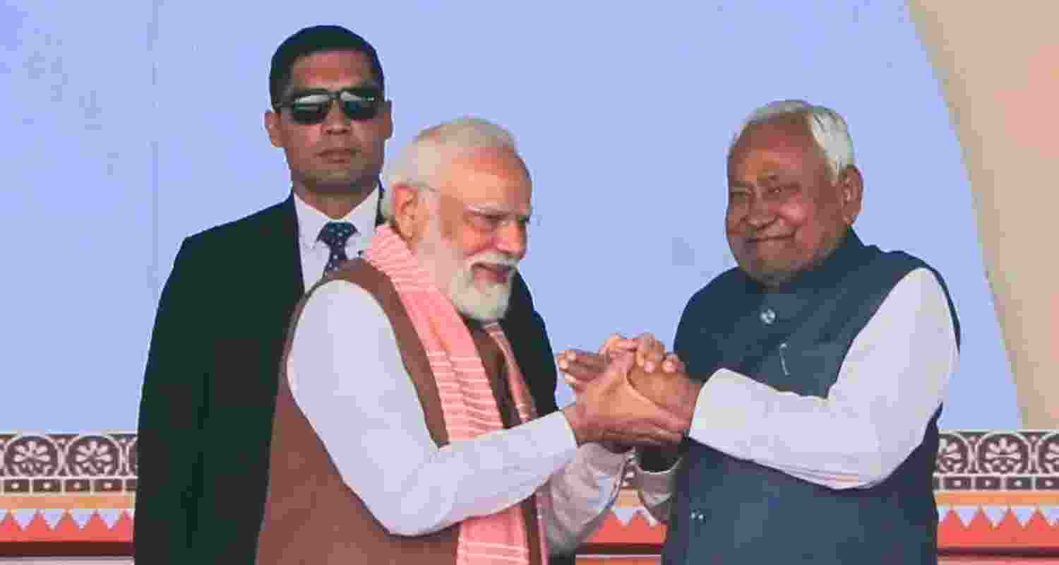 JD(U) supremo Nitish Kumar waves to the gathering during his swearing-in ceremony as the Chief Minister of Bihar, at Gandhi Maidan in Patna, Thursday. JD(U) supremo Nitish Kumar waves to the gathering during his swearing-in ceremony as the Chief Minister of Bihar, at Gandhi Maidan in Patna, Thursday.